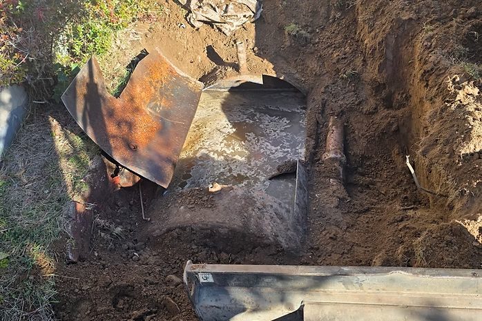 Buried oil tank opened, pumped out, and cleaned during decommissioning near Levittown