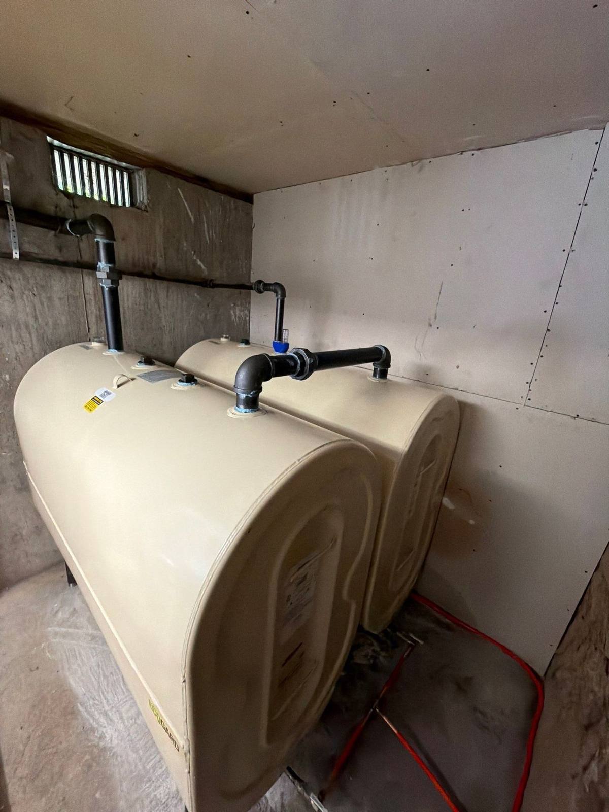Twin heating oil tank installation in a Nassau County basement